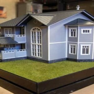 تصميم المجسمات المعمارية بالرياض - مجسم معماري لبناء سكني باللون الزرق مخطط باللون الأبيض، ما عدا السقف ملو باللون الأسود